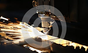 Neon sparks fly out machine head, equipment for metal processing laser metal