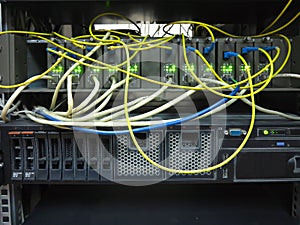 Close up network cables connected to switch in server rack