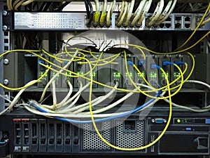 Close up network cables connected to switch in server rack