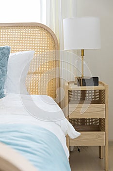 New bed comfort with decorative pillows ,headboard and side table lamp.