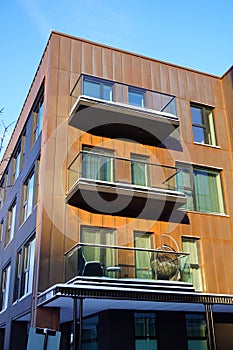 Close up of new building facade with balconies during winter time. Kalamaja, Tallinn, Estonia, Europe. January 2024