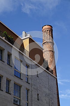 Close up of new building grey facade with windows in Noblessner new district in Tallinn, Estonia, Europe. Old tower on