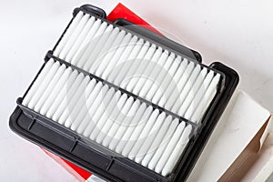 Close-up on a new car filter for an engine as a background with vertical stripes. Spare parts for vehicles, repairs and