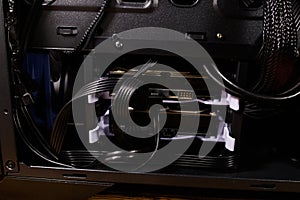 Close-up of new computer system unit with installed hard drives. Desktop PC from the inside