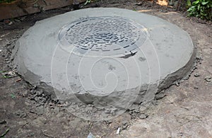 Close up on new concrete septic tank with plastik manhole installation