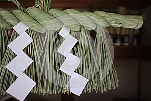 A close-up of a new Japanese shimenawa