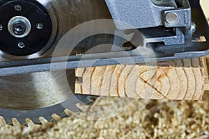 Close-up of new modern powerful circular electrical saw cutting