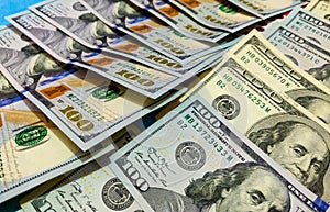 Close up of new and old american hundred dollar bills bank notes background