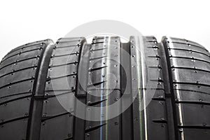 Close up new tyre isolated on white background