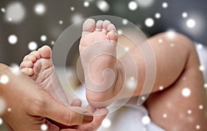 Close up of newborn baby feet in mother hands