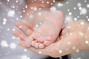 Close up of newborn baby feet in mother hands