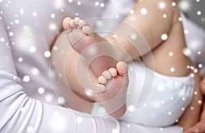 Close up of newborn baby feet in mother hands