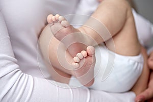 Close up of newborn baby in mother hands