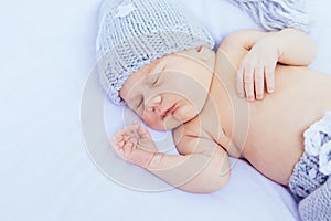 ÃÂ¢ewborn baby sleeping wearing grey hat and panties photo
