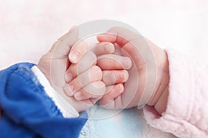 Close up of newborn twins hands