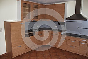 a Close-up of a newly delivered empty corner kitchen before moving in