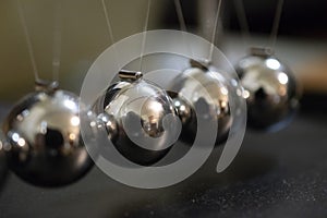 Newton`s Cradle Closeup. Physics Energy photo