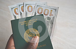 Close up Nigerian Passport with Dollars currency