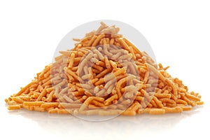 Close-up of Nimbu masala besan sev Indian namkeen snacks,  Indian spicy snacks Namkeen, in a pile or heap, isolated over white