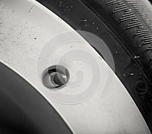Close-up nipples wheels car. Tyre valve