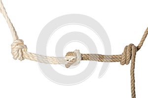 Close-up of node or knot from a white and brown rope isolated on