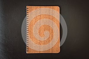 Close up notebook or notepad isolated on black background - Vintage filter