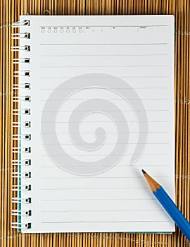 Close up of notebook with pencil