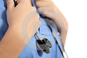 Close up of a nurse hands with stethoscope photo