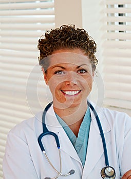 Close up of nurse in scrubs and lab coat