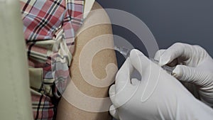 Close-up of nurses are vaccinations to patients using syringe