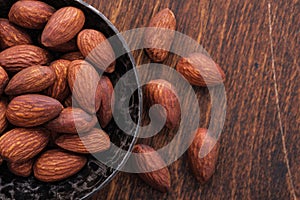 Close-up nuts almonds on wooden table