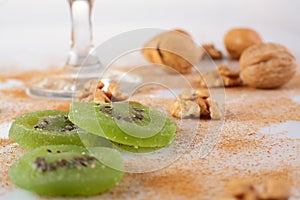 Close up of nuts, kiwis and cinamon