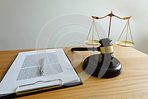 Close up object  law concept. Judge gavel with justice lawyers and documents working on table