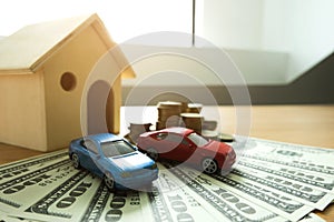 Close up object Money exchange with real estate. Contract on trading a car and house concept