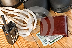 Close-up objects - walkie-talkie, rope and money