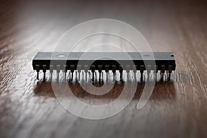 Close up of obsolette microchip on wooden table