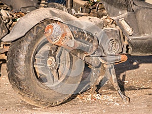 Close up with a off road rusted motor scooter wheel