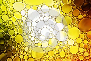 Close up of oil drop on water surface.