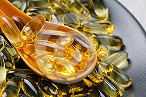Close up of  oil filled capsules suitable for: fish oil, omega 3, omega 6, omega 9,  vitamin A, vitamin D, vitamin D3, vitamin E