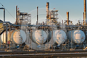 Close up of oil refinery at sunset