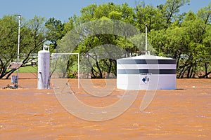 Close-up of oil tank under water as a result of midwestern storms and flash flooding