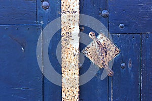 Close-up of old blue door with door handle