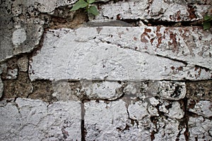 Close up of old brick wall at a former prison in Asia sloppily p