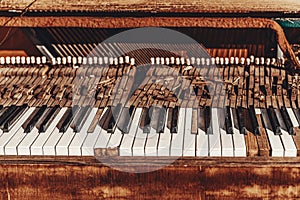 Close-up of old broken piano, damaged piano claviature photo