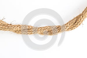 Close up old brown rope on white backgroundused for decoration photo