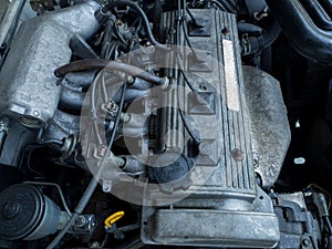 Close up old car engine full of oil stains