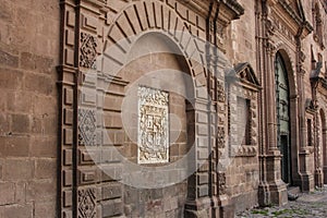 Close up of old catholic church facade in Cuzco Peru