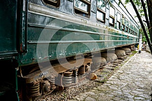 Close-up of old Chinese green leather train carriage