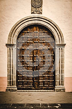 Close up of an old door. Big gate door. Vintage building gate. Historic centre of La Orotava on Tenerife, Canary Islands