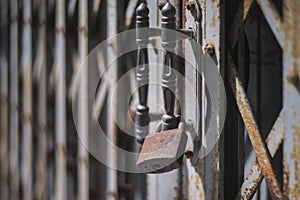 Close up old door locked with chain and padlock